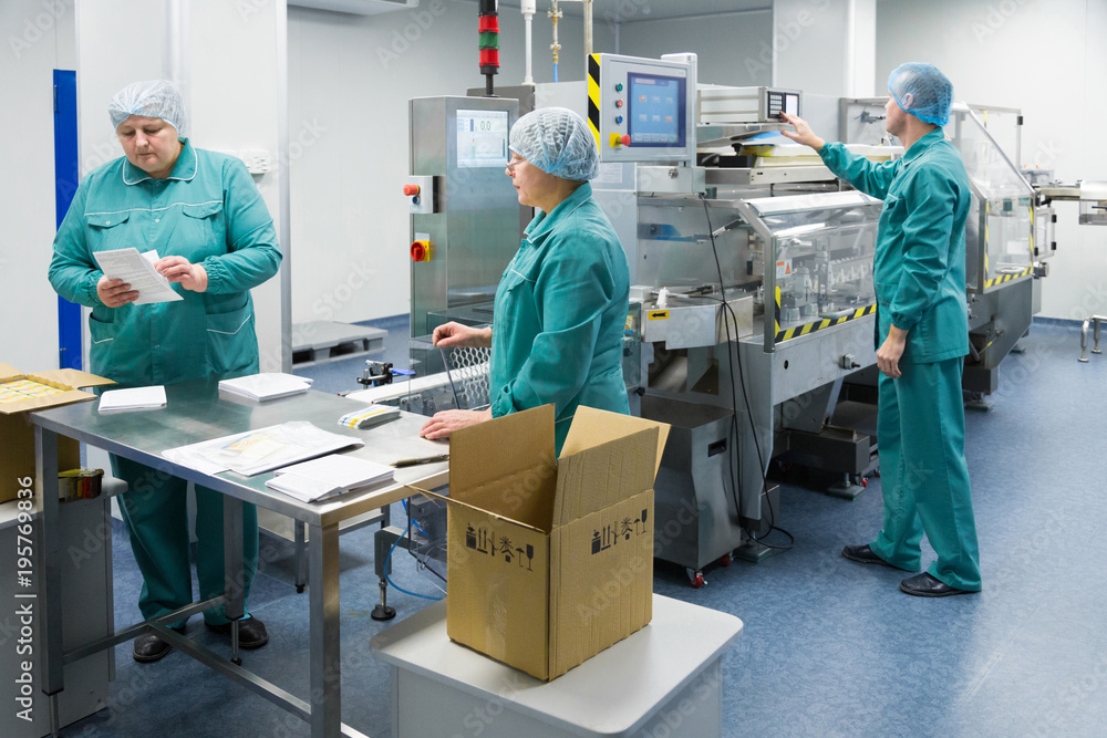 Canvas Prints pharmaceutical factory workers in sterile environment