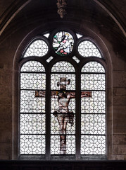  Jesus on the cross painted on the glass of a window inside the church of St. Stephen's of the Mount in Paris.