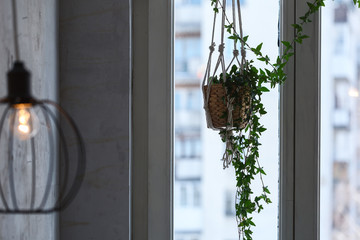 loft interior. conceptual light bulb on window background