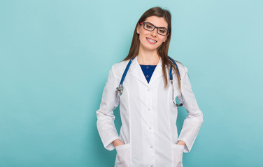 Attractive female doctor in white coat and glasses