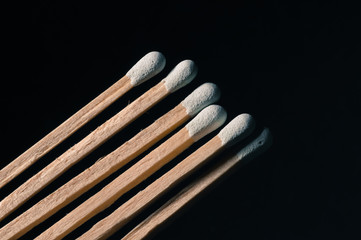 Grouped grey matchsticks in a row