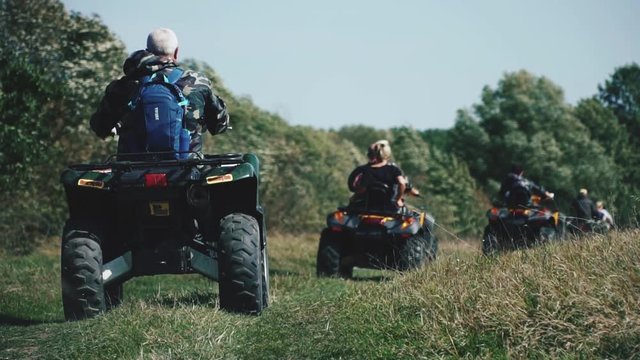 A trip on an ATV for off-road and dirt. Driving POV on an ATV on a rural wilderness road through a forest tours for tourists, outdoor recreation, travel organization