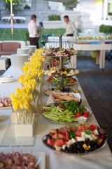 Buffet self-service food/Buffet served table with snacks,fruits,canape,sweets and appetizers.Catering event plate service.Smorgasbord,food choice of breakfast in restaurant