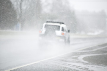 Off road type vehicle traveling on icy road.