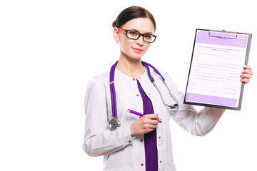 Young beautiful female doctor showing on clipboard with pen on white background