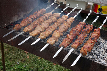 Preparation of shish kebab on skewers