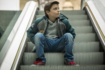 boy on escalator