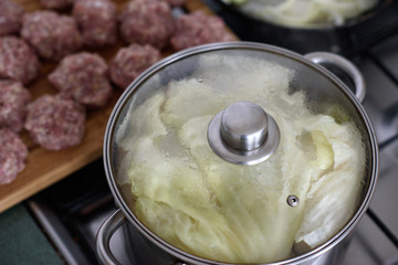 Cooked cabbage leaves in a saucepan