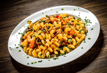Pasta with meat, tomato sauce and vegetables