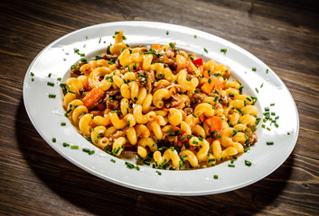 Pasta with meat, tomato sauce and vegetables