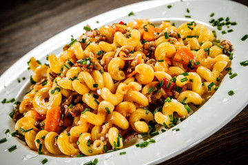 Pasta with meat, tomato sauce and vegetables