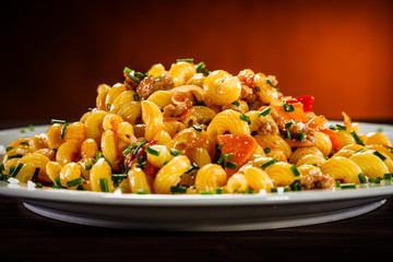 Pasta with meat, tomato sauce and vegetables