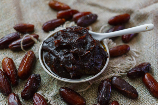 Raw Organic Fresh dates together with fint jam from dates .
