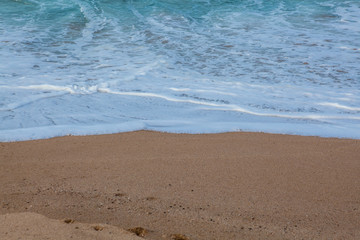 Fototapeta na wymiar Wave on the sand beach background