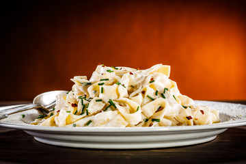 Pasta carbonara on wooden table