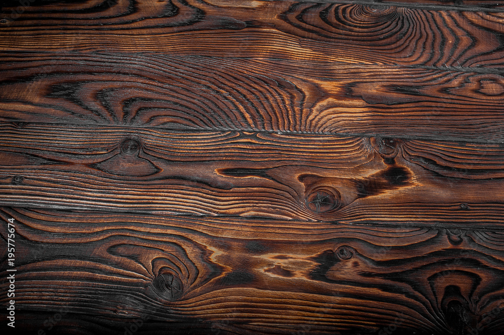 Wall mural brown scratched wooden cutting board. wood texture