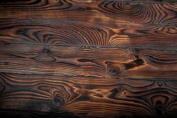 Brown scratched wooden cutting board. Wood texture