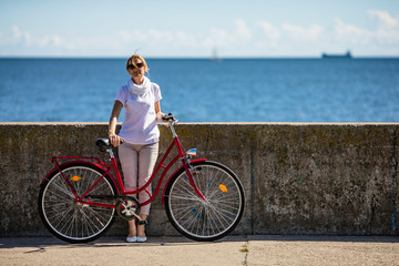 Woman and bike on pier