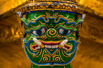 Fototapeta premium Clouse-up of Yak Face, common as guardians of the gates in Buddhist temples, Grand Palace, Bangkok