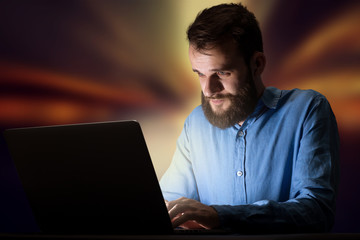 Businessman in the office at night