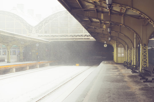 Empty snowy platform on railway station