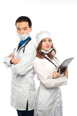 Fototapeta premium Happy team of two physicians standing back to back with arms folded isolated on white background