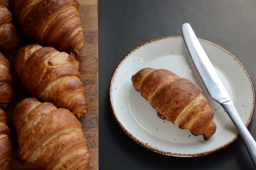 Fresh croissant on a black background.  