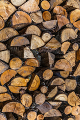 Broken wood, firewood background close up. Natural wood drying. Brown firewood.