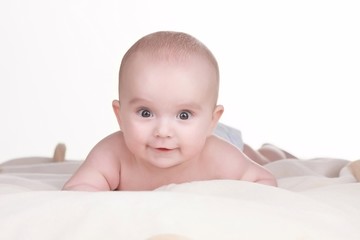 Portrait of baby boy lying on blanket. Cute little baby