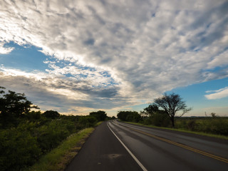 Highway in Uruguaiana, Brazil with dramatic cloudy, blue sky background