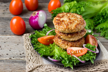 Homemade cutlets with a vegetables on a plate.