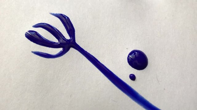 Beautiful watercolor blue ink drops on white paper. Artists paint with a brush, flowers on paper