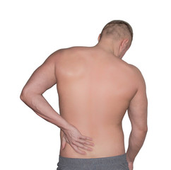 back pain. a man holds his hand on his lower back