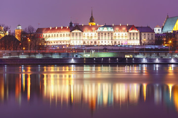 Fototapeta na wymiar Royal Castle in Old Town with reflection in the Vistula River during evening blue hour, Warsaw, Poland.