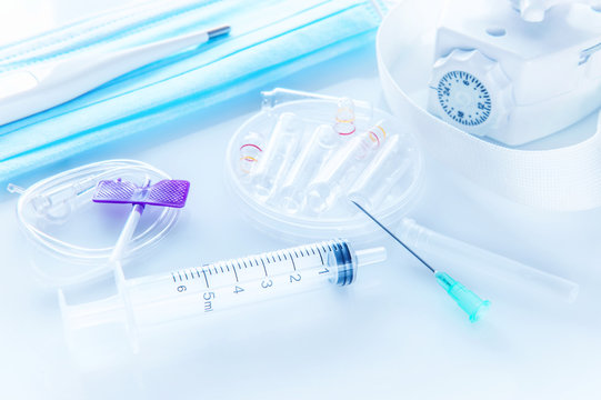 Medical tools Syringe with needle drip and a catheter for intravenous injection ampoules gloves and medical masks for administering drugs, and thermometer.