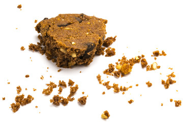 Last bite! Α bitten cookie with crumbs, isolated on white