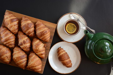 Fresh croissant on a black background.  