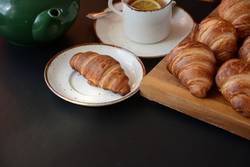 Fresh croissant on a black background.  