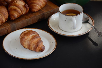 Fresh croissant on a black background.  