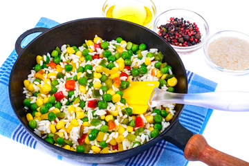Frozen Hawaiian mix of vegetables with rice in frying pan
