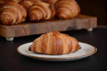 Fresh croissant on a black background.  