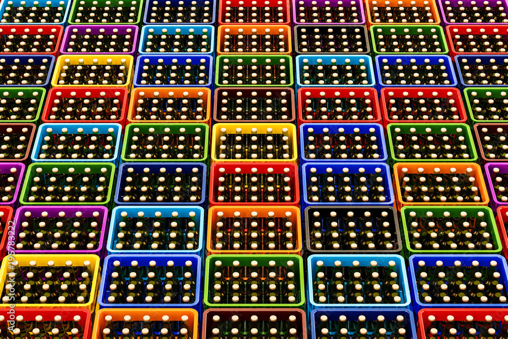 Poster background from colored plastic crates full of beer bottles, top view. 3d rendering