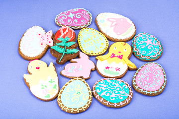 Colorful вelicious Easter gingerbread cookies background. Eggs, rabbit, chicken  with different pattern icing. Top view