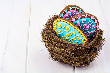 Symbols of the holiday Easter-nest, eggs, cookies