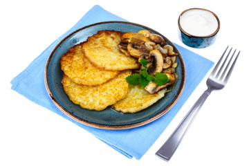Hot potato pancakes with fried mushrooms