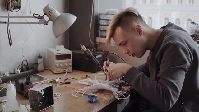 Technician is working on fixing drone