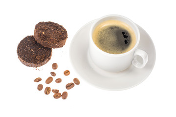 White cup with espresso, waste from the coffee machine