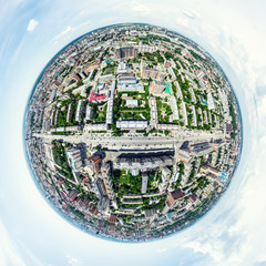 Aerial city view with crossroads and roads, houses, buildings, parks and parking lots, bridges. Helicopter drone shot. Wide Panoramic image.