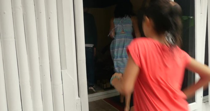 Group of young excited healthy children running into a room