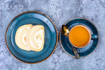 Tea and piece of curd biscuit rolls